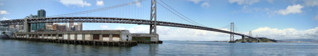 Panoramic of the Piers, Downtown, San Francisco Bay Bridge, and Treasure Island on a nice day with Oakland Harbor in the Background.の写真素材