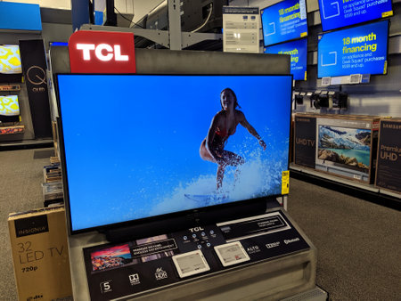 Honolulu - September 21, 2019:  TCL 4k HDR TV with surfer on screen on display at Best Buy.のeditorial素材