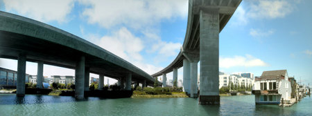 Two Highway overpass on large pillars towers intersect over the park below in San Francisco Mission Bay area.  Panoramicの写真素材