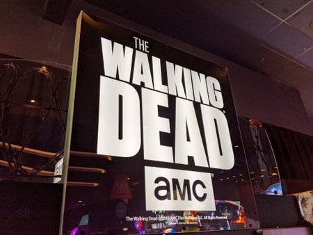 Honolulu - November 17, 2019: Walking Dead AMC Arcade game sign inside Dave and Busters in Honolulu, Hawaii.のeditorial素材