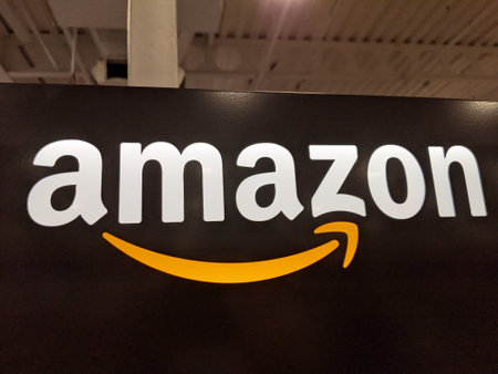 Honolulu - November 7, 2020:  Amazon logo on black shiny wall in Honolulu Best Buy store.  Amazon is an American international electronic commerce company. It is the world's largest online retailer.のeditorial素材