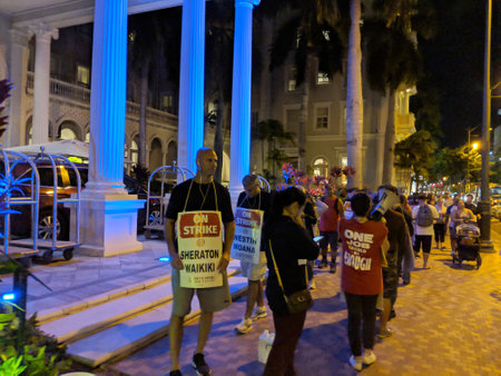 Honolulu - November 19, 2018: Hotel Strikers march against Sheraton Waikiki saying one job should be enough at night.のeditorial素材