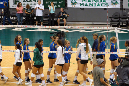 Honolulu - September 25, 2015: The University of Hawaii womenâs volleyball team celebrating their victory over UC Santa Barbara in four sets on . The photo was taken at the Stan Sheriff Center in Honolulu, Hawaii, where the Rainbow Wahine won the match,のeditorial素材