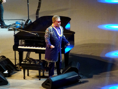 Honolulu - January 10, 2015: Elton John stands and yells next to piano at the Neal S. Blaisdell Center.のeditorial素材