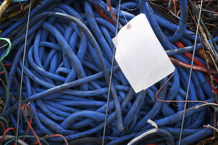 Blue Bundled Wires and White Tag ready for Recyclingの写真素材