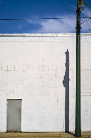 Green Lamp Post   White Buildingの写真素材