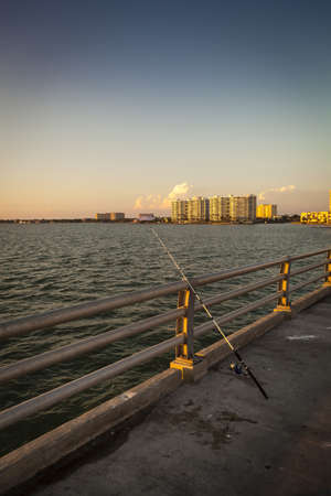 Fishing Pole against the Railの写真素材