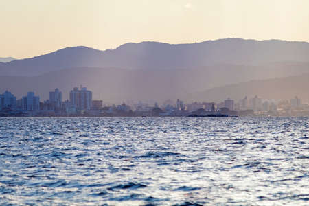 Row of buildings on the coast of FlorianÃ³polis at sunset, Santa Catarina, Brazil.