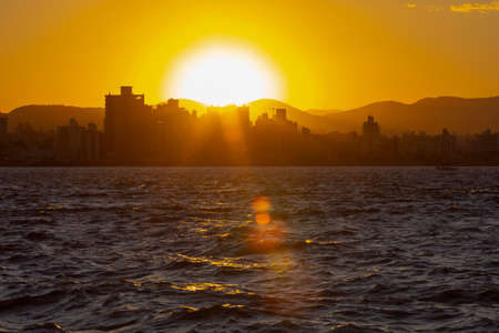 Row of buildings on the coast of FlorianÃ³polis at sunset, Santa Catarina, Brazil.の写真素材