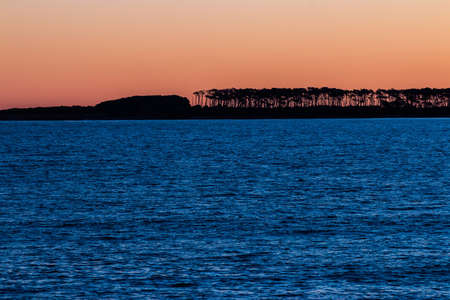 Sunset on the deck of Punta del Este beach in Uruguayの写真素材