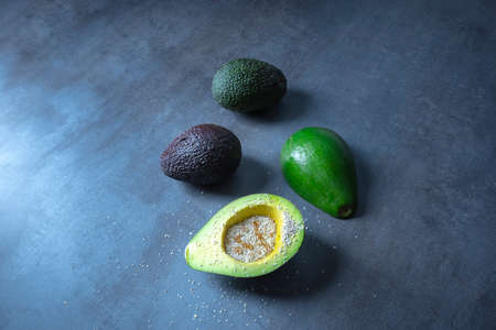 Avocado with oats and honey, gray stone background, seen from above.の写真素材