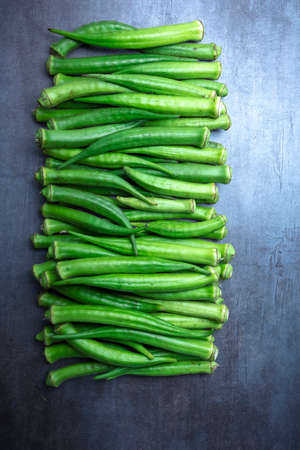 okra on gray table, seen from above, free space.