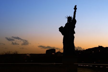 Silhouette of the Parisian Statue of Liberty - Paris, Franceの写真素材