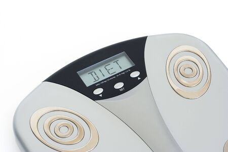 Bathroom scale showing DIET on its display