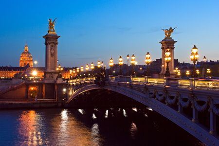 The Alexander III bridge and the dome of the Invalides at night - Paris, Franceの写真素材