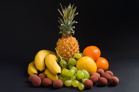 Various fresh fruits on a dark backgroundの写真素材