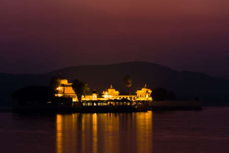 Night view of Lake palace island of Jagmandir, on Pichola lake - Udaipur, Rajasthan, Indiaの写真素材