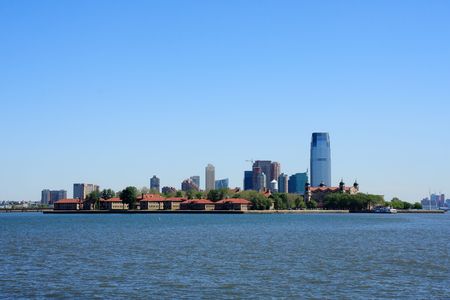 Ellis Island with New Jersey buildings in the background - New York City, USAの写真素材