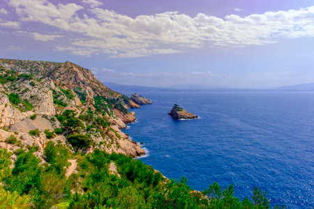 Cote Bleue coastline part of the Estaque mountain range by the Mediterranean sea and Riou island in the background, Provence Franceの写真素材
