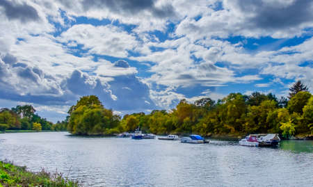 Moored boats on the river Thames on a overcast day in summer , Richmond London U.Kの写真素材
