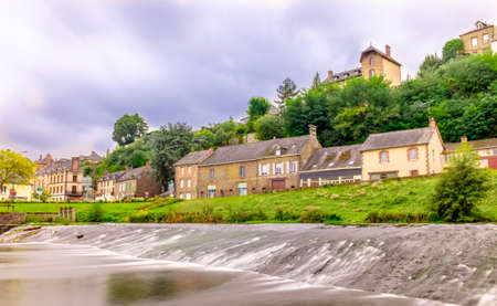 Ambrieres-Les-Vallees village in Mayenne by the river Varenne on a summer day, Franceの写真素材