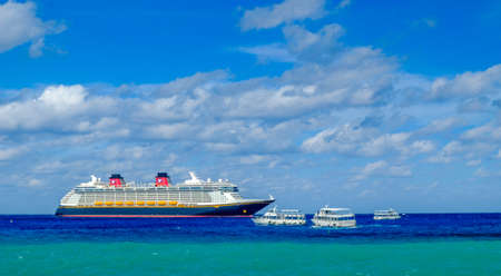 Grand Cayman, Cayman Islands, Dec 2017, cruise ship Disney Fantasy with marine shuttles on the...
