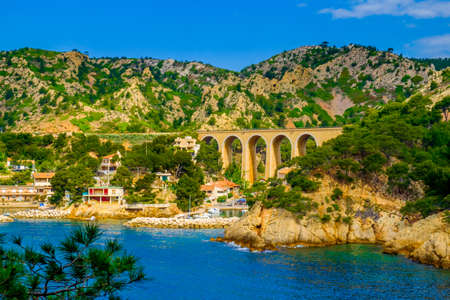The "Cote Bleue" with Grand-Mejean Port and its railway bridge on the Estaque mountain range by the Mediterranean sea, Provence France, April 2017の写真素材