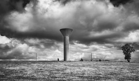 Water tower in the Normandy countryside on a overcast day in summerの写真素材