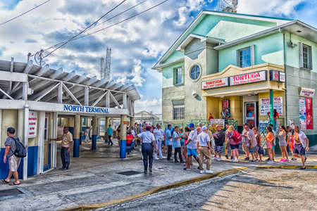 George Town, Grand Cayman, Cayman Islands, tourists by the port North terminal queuing to re-embark on their cruise shipのeditorial素材