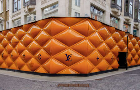 London, U.K, March 2019, building site fence panel for a Louis Vuitton shop in the Mayfair areaのeditorial素材