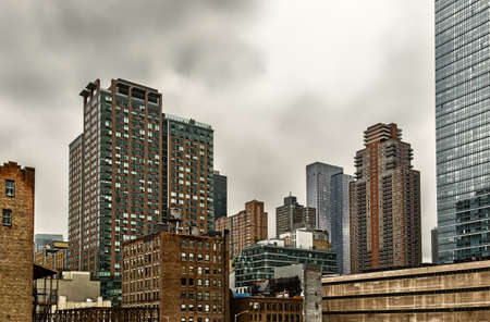 New York City, U.S.A, May 2019, view of skyscrapers on the 11th Ave & W 45th St on an overcast day in Hell's Kitchenのeditorial素材
