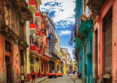 Havana, Cuba, July 2019, urban scene in a street with very colorful buildings in the oldest part of the cityの写真素材