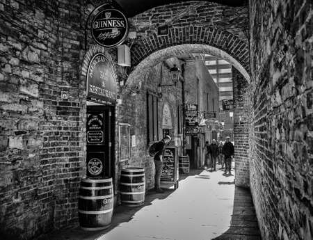 Dublin, Ireland, March 2018, outside the Merchant's Arch restaurant in a alley of the Temple Bar districtの写真素材