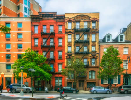 New York City, USA, May 2018, example of the gentrification in the East Village with two old buildings in between modern constructions in Stuyvesant streetのeditorial素材