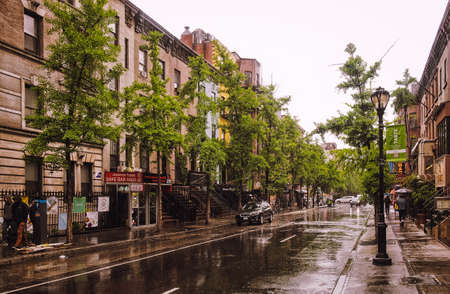 New York City, USA, May 2019, urban scene on a rainy day on the W 46th St between the 8th & 9th Avenue in Hell's Kitchen, Manhattanのeditorial素材