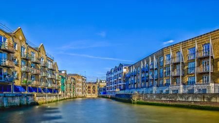 Poplar district, U.K, Sept 2018, buildings by the river Thames in the Borough of Tower Hamlets in East Londonのeditorial素材