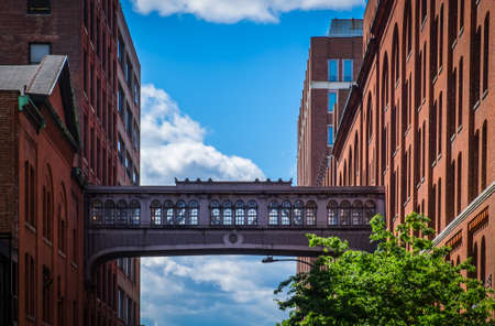 New York City, USA, May 2019, view of the West 15th street skybridge between two buildings above one of downtown Manhattan streetのeditorial素材