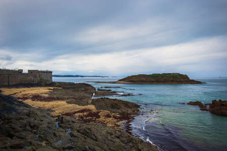 View of Grand Be island opposite St-Malo rampart, Franceの写真素材