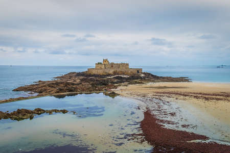 St-Malo, France, Sept 2020, view of Bon-Secours beach and a fort on Grand Be a tidal island near the coastのeditorial素材