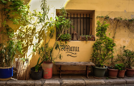 Marseille, France, May 2022, view of a bench and plants in a street of Le Panier districtのeditorial素材