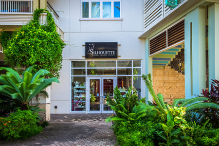 Grand Cayman, Cayman Islands, Aug 2022, view of a modern building with a store in Camana Bayの写真素材