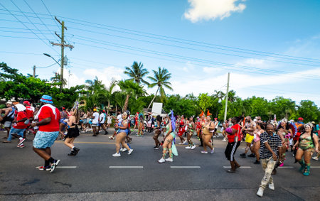 Grand Cayman, Cayman Islands, July 1st, 2023, carnival goers parading during CayMas Carnival on West Bay Roadの写真素材