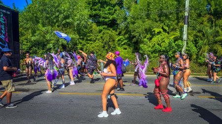 Grand Cayman, Cayman Islands, July 1st, 2023, carnival goers parading during CayMas Carnival on West Bay Roadの写真素材