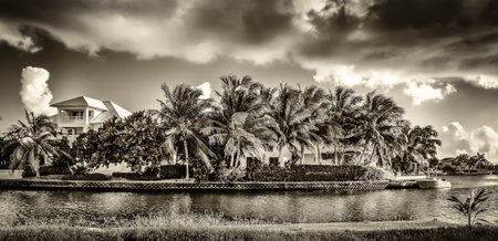 Grand Cayman, Cayman Islands, Nov 6th 2018, houses in the Grand Harbor area by a canal leading to the Caribbean Seaの写真素材