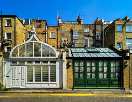 England, United Kingdom, April 17th 2023, view of two front conservatories in a street in the Royal Borough of Kensington and Chelseaの写真素材