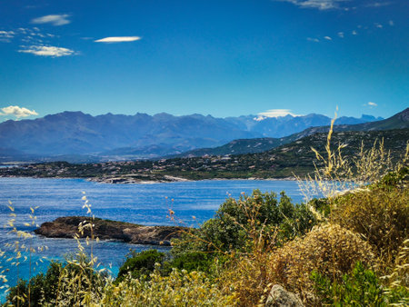 View of La Revellata Peninsula on l'Ãle-Rousse by the Mediterranean Seaの写真素材