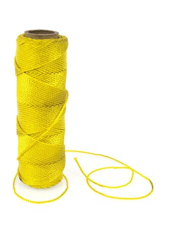 Yellow thread spool isolated on white background