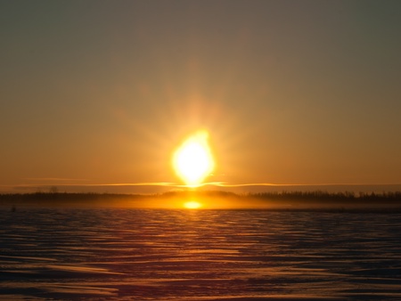 Foggy fields winter sunrinse after big  snow stormの写真素材