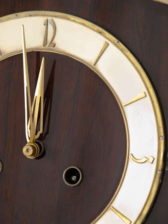 Old chessnut clock ivory dial with  golden accentsの写真素材