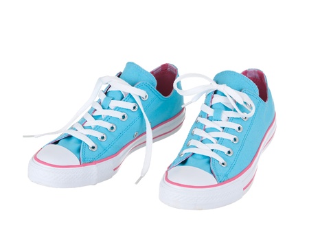 Vintage hanging blue shoes on pure white backgroundの写真素材